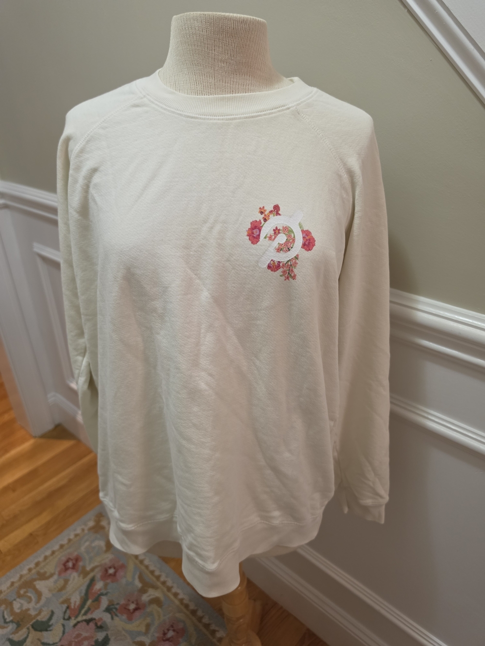Peloton Cream Sweatshirt with Pink Floral Logo